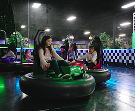 Kids and families enjoying bumper cars at Grand Slam Family Fun Center in Coon Rapids MN